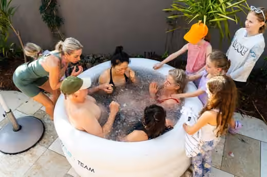 Families trying the ice bath at Evolve X Byron Bay