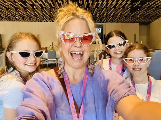 Sarah with kids in heart sunglasses at Evolve X Byron Bay